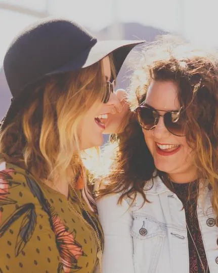 Two friends laughing together